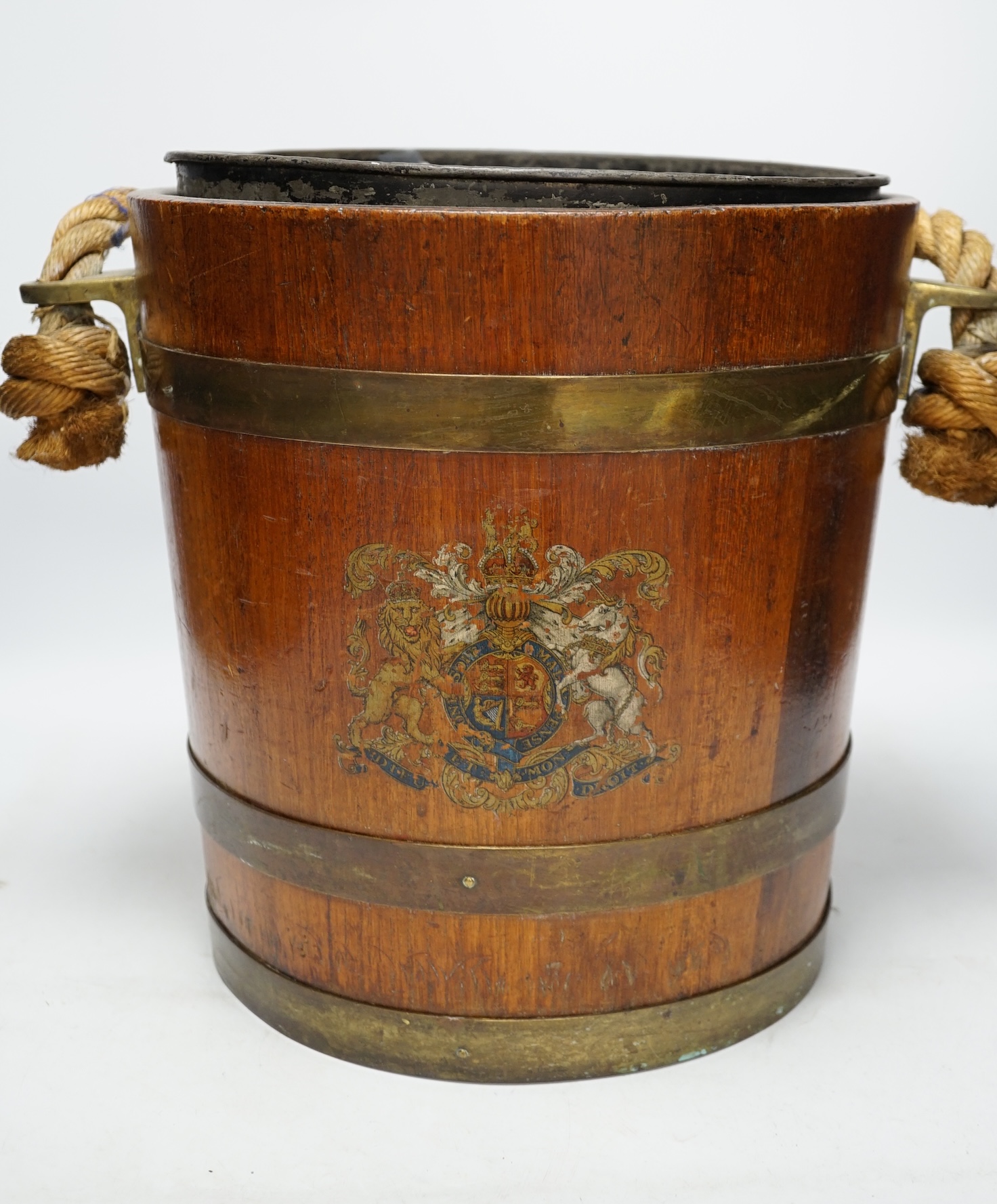 A 19th century naval brass bound painted teak bucket with rope handle, 31cm. Condition - fair
